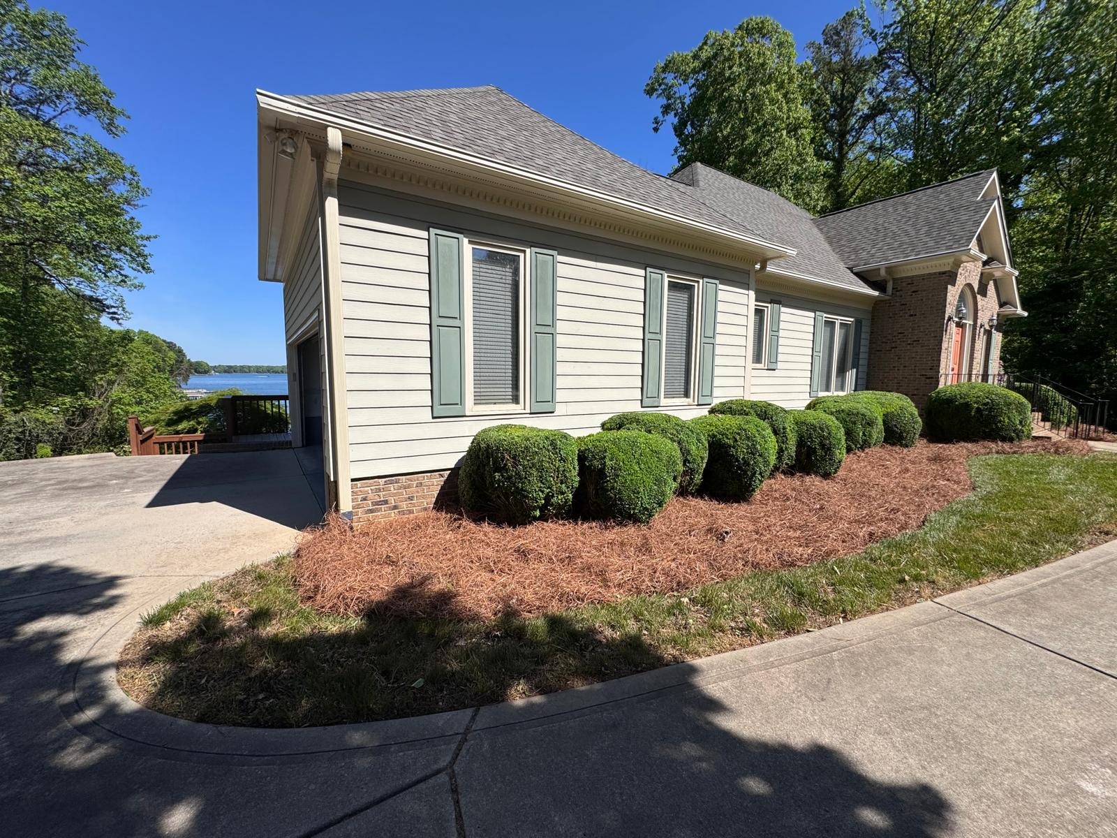Rounded foundation shrubs and refreshed pine straw beds