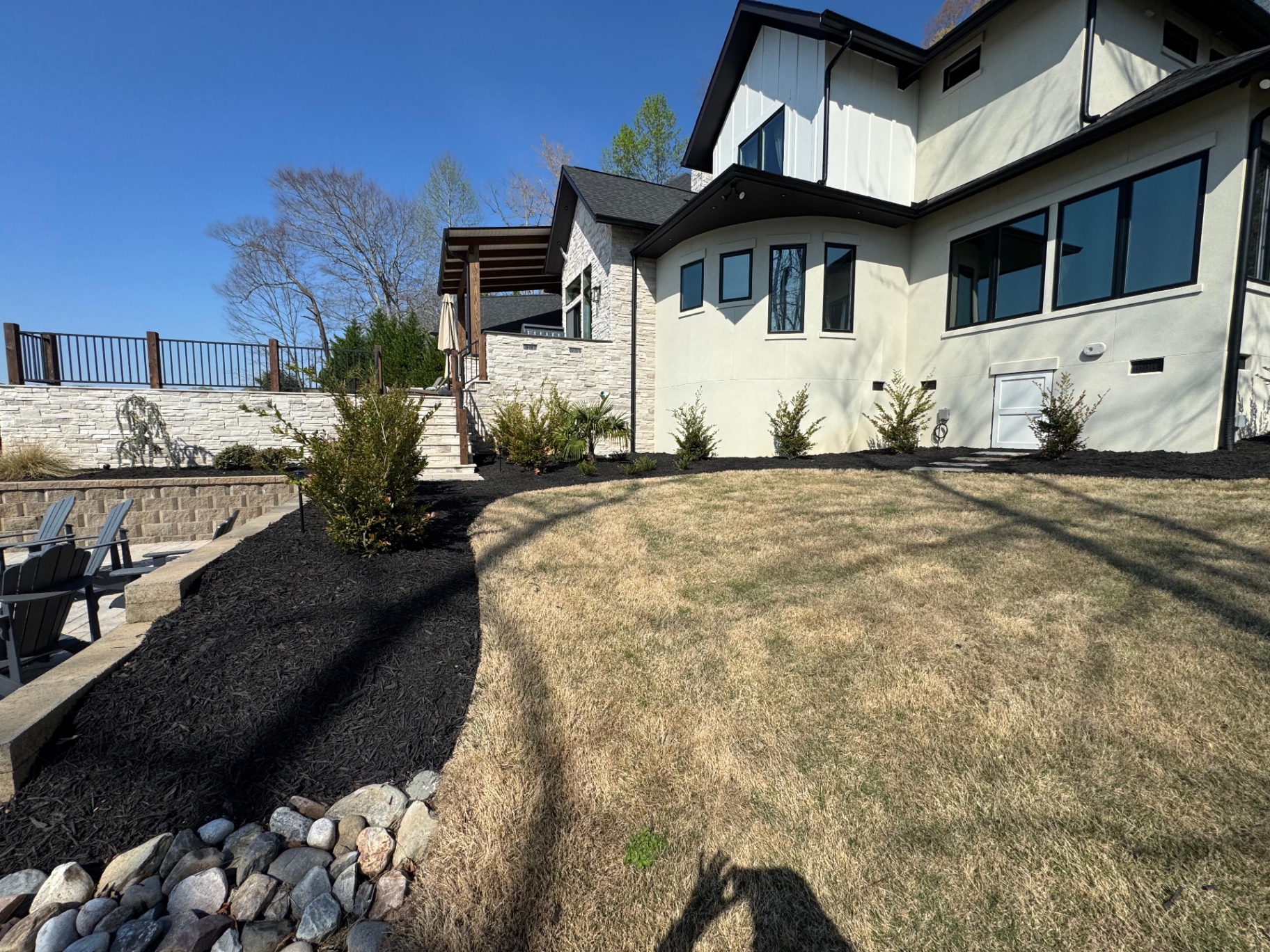 Mulched garden beds and newly planted tree